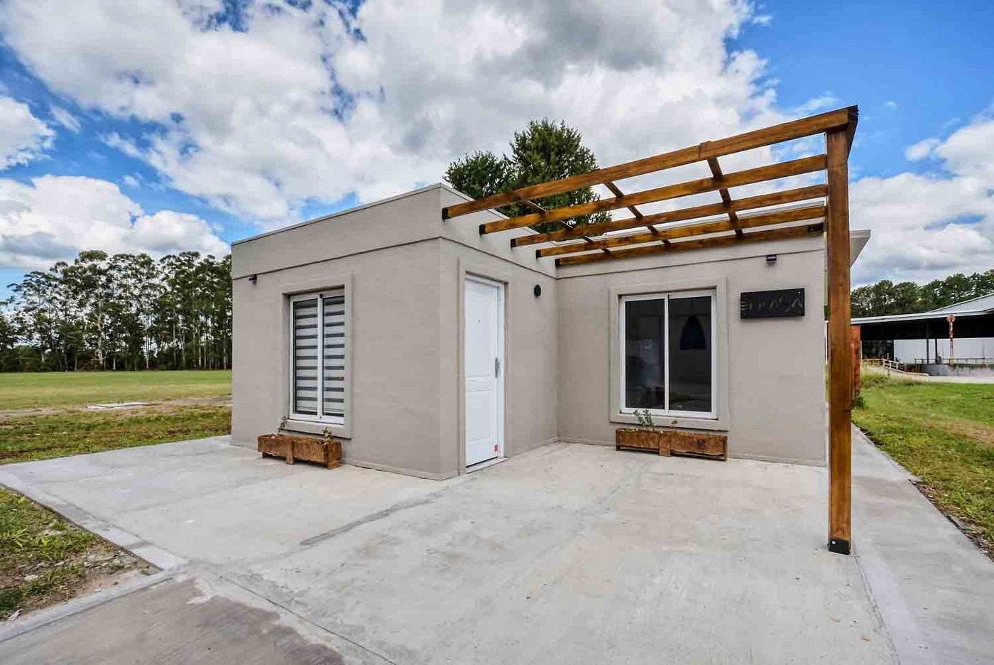 Vivienda con pérgola construida con Inbuild System